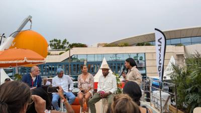 Dr. Glay at an outdoor industry panel