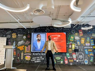 Dr. Glay delivering a keynote on Leading with Resilience, Purpose, and Authenticity at Kraft Heinz